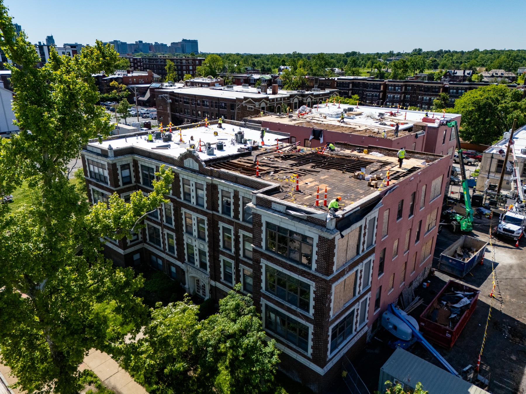Wide aerial view of Gringo Roofing's commercial roof replacement project