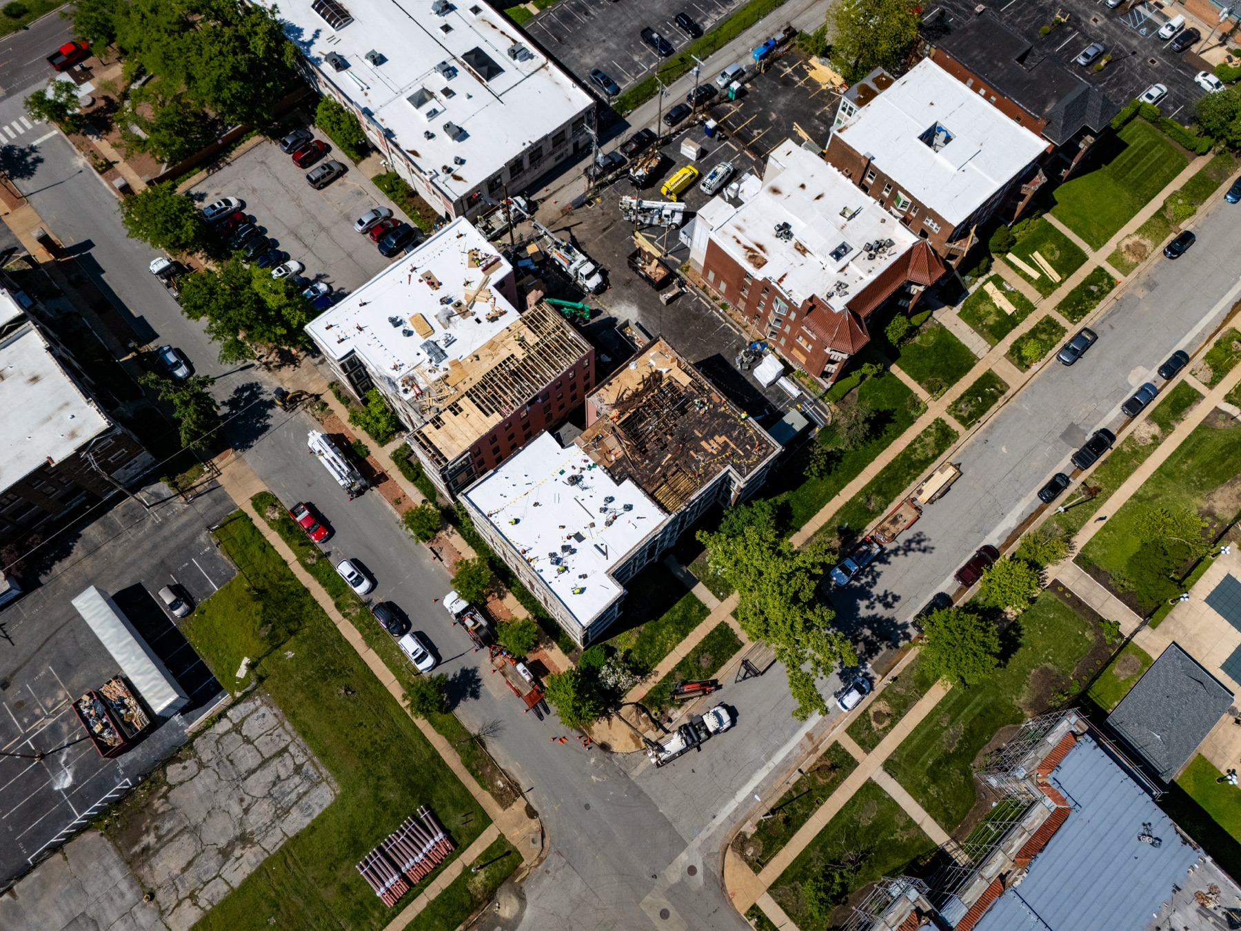 Overhead view of commercial roof replacement progress at 5636 Waterman Boulevard